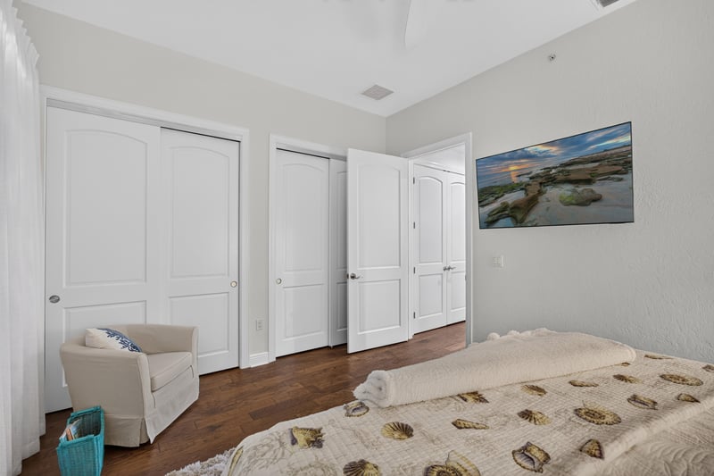 Bedroom with two beds and closet doors at 140 Ave De La Mer, Palm Coast, FL 32137