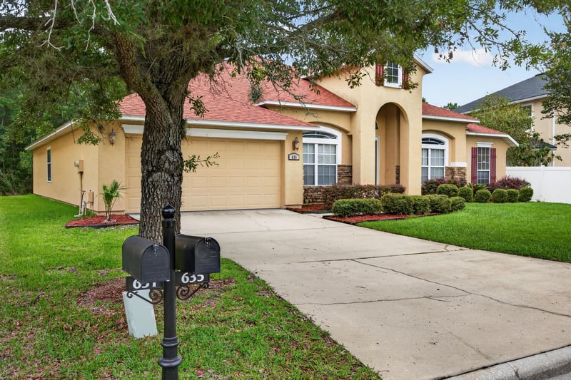 Front exterior with mailbox and driveway at 635 Wakeview Dr, Orange Park, FL 32065