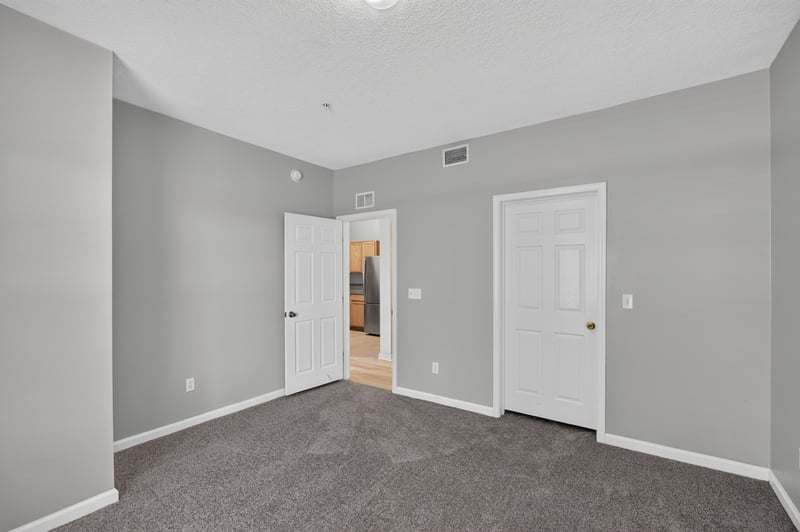 Bedroom corner with two doors at 575 Oakleaf Plantation Pkwy, Orange Park, FL 32065