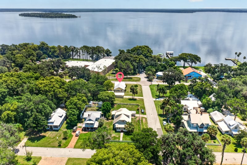 Drone view overlooking the lake and neighborhood in Crescent City, FL