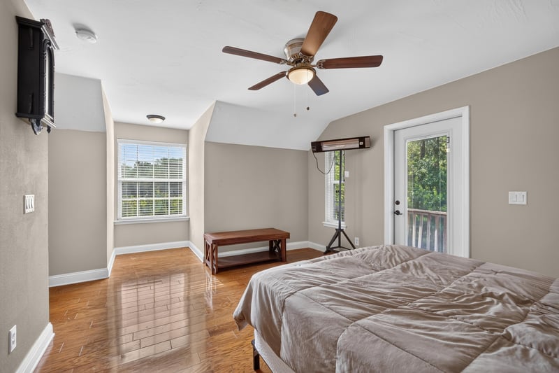 Bedroom with French doors and hardwood floors at 1735 Hagans Ridge Ct