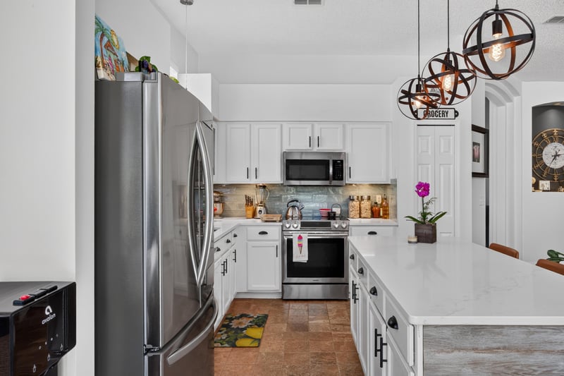 Kitchen with stainless appliances and pendant lighting at 1820 Burgess Hill Dr E, Jacksonville, FL