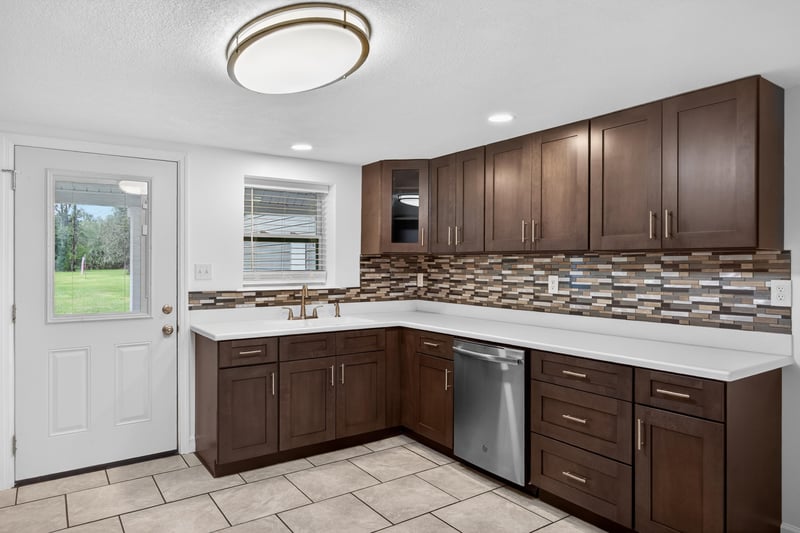 Kitchen corner with white door leading outside at 1619 Hammond Blvd, Jacksonville, FL