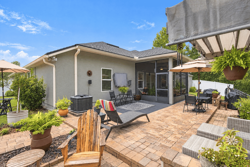 Patio with house exterior and retractable awning at 10923 Black Diamond Ct, Jacksonville, FL