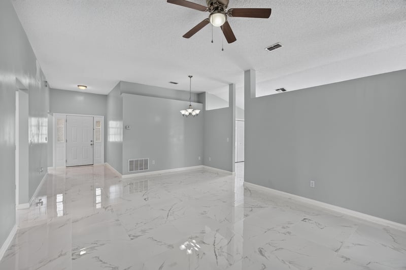 Open living space with ceiling fan and pendant light at 490 Hillside Dr, Orange Park, FL 32073