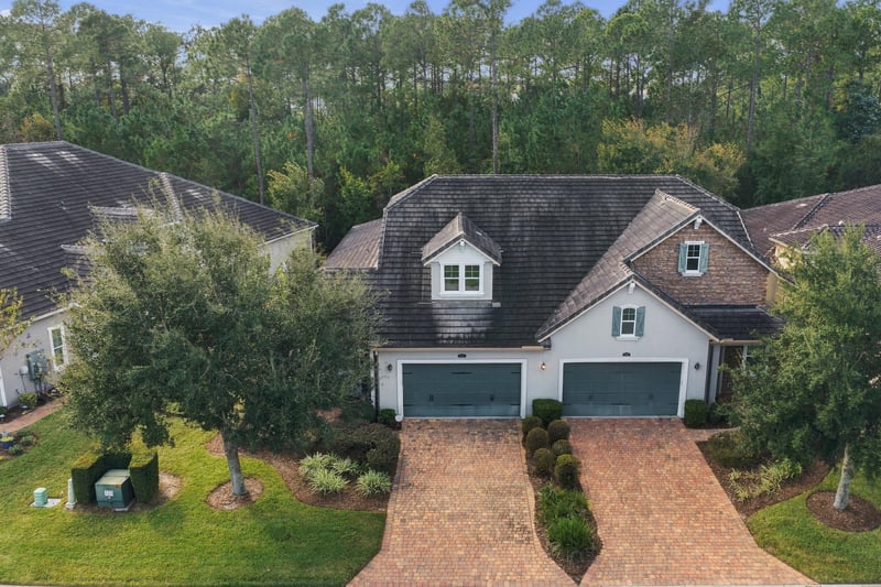 Aerial view of front exterior and driveway, photographed by Megapixeler on Lucena Ln, Jacksonville, FL