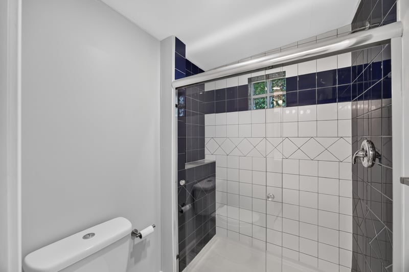Bathroom shower with tile surround at 2256 Inwood Cir S, Jacksonville, FL