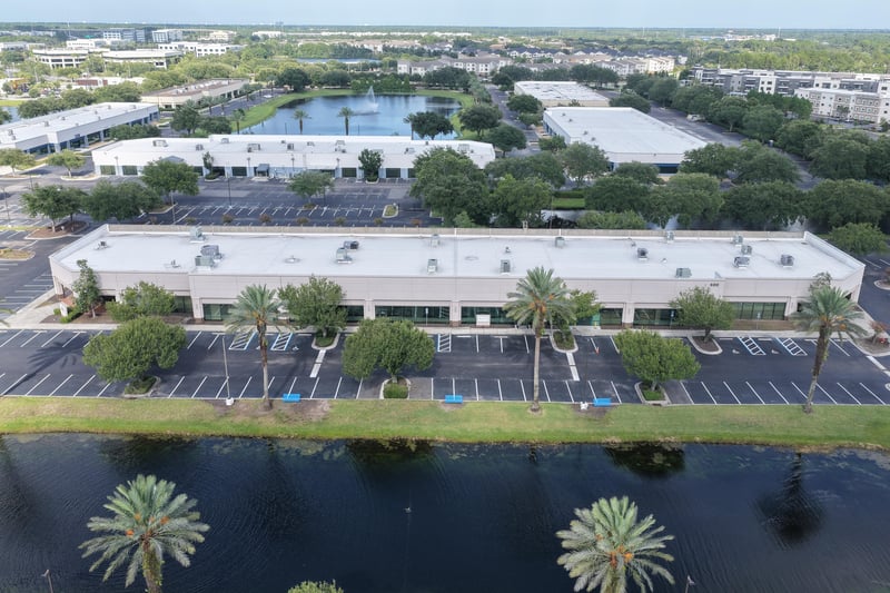 Aerial view of a roofline with ponds and multi-story building beyond at 10550 Deerwood Park Blvd, Jacksonville, FL 32256