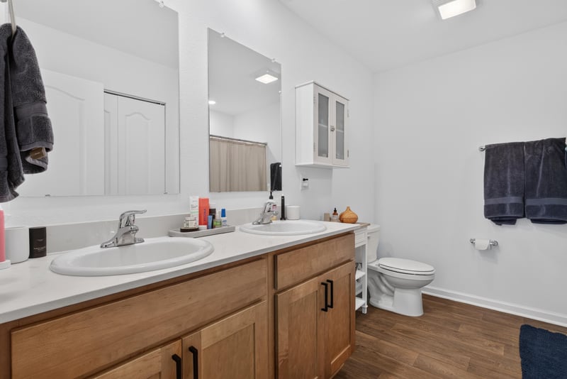 Primary bathroom with wood vanity at 4276 Quaking St, Jacksonville, FL 32218