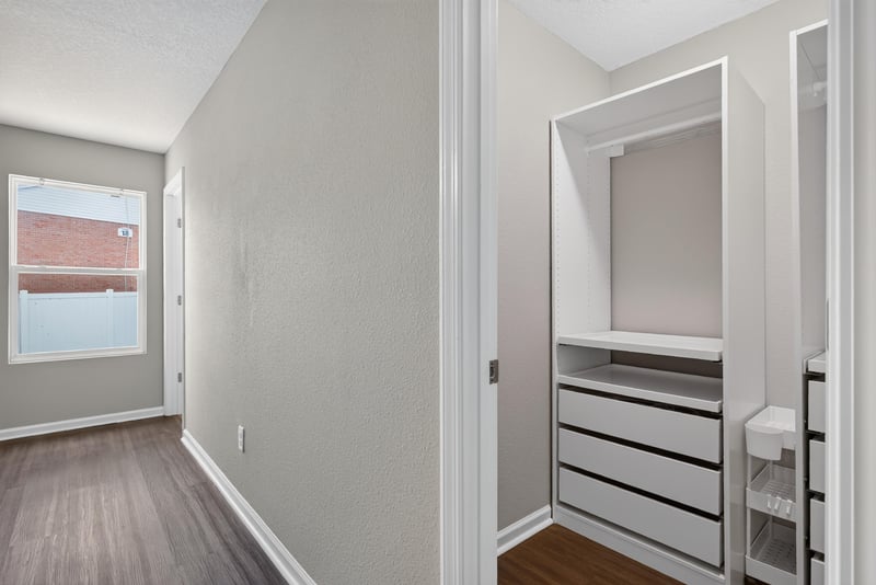 Walk-in closet with built-in shelving at 7253 Townsend Village Ct, Jacksonville, FL