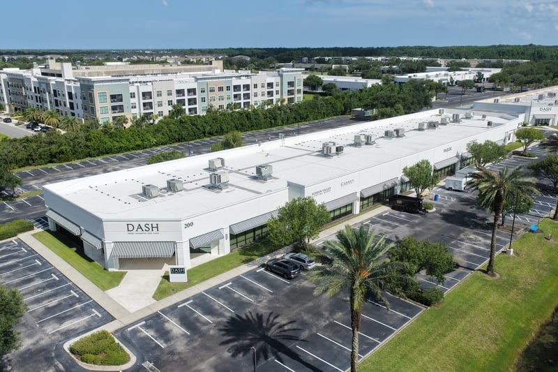 Aerial view of the DASH building roof with multi-story building behind at 10550 Deerwood Park Blvd, Jacksonville, FL 32256