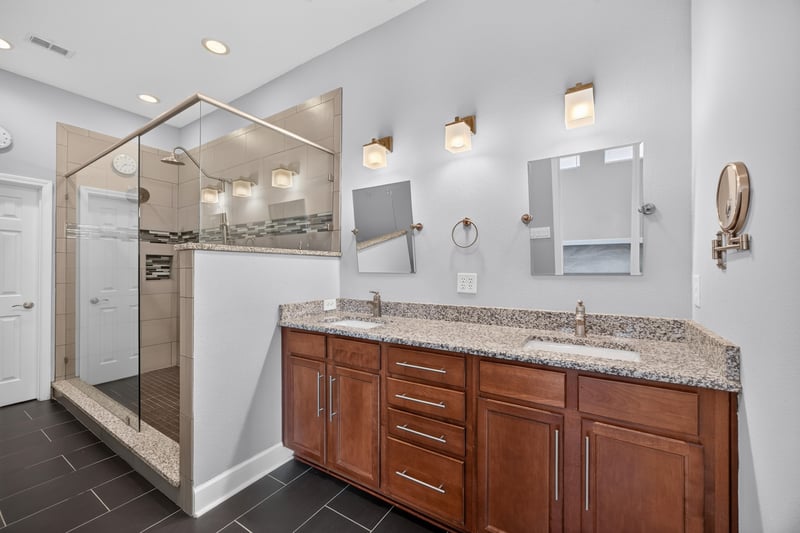Primary bathroom with dual vanity and glass shower at 6217 Eclipse Cir, Jacksonville, FL 32258