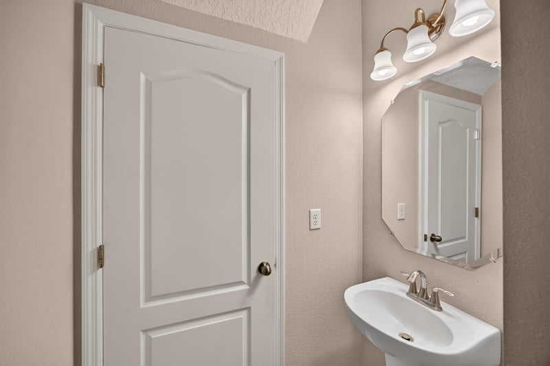 Half bathroom with pedestal sink at 3762 Hartsfield Forest Cir, Jacksonville, FL 32277