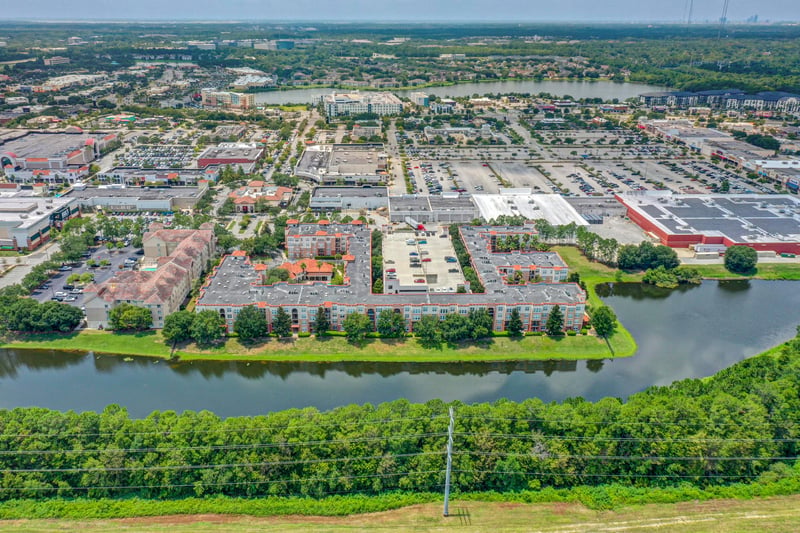 Wide aerial view of the neighborhood and waterway in Jacksonville, FL