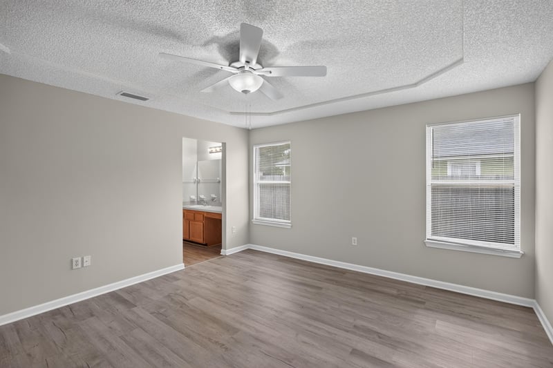 Bedroom with vaulted ceiling and ceiling fan at 8519 Blazing Star Ct, Jacksonville, FL 32210