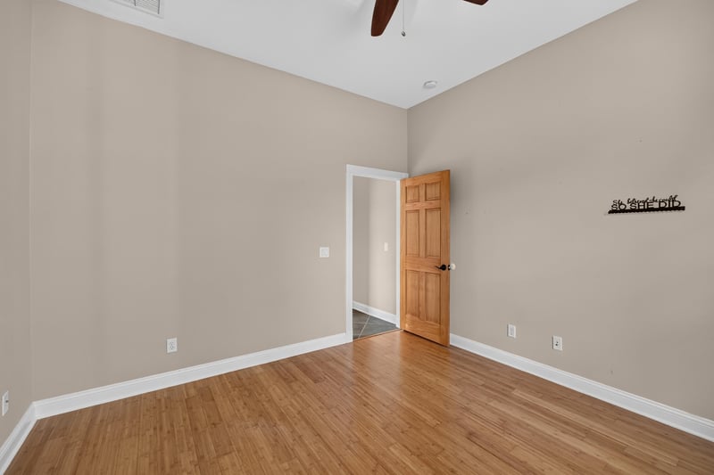Hallway with wood doors and hardwood floors at 1735 Hagans Ridge Ct