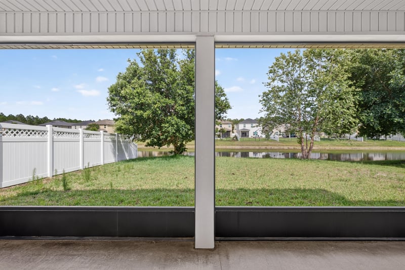 Screened patio overlooking fenced yard at 263 Gilmore Ln, Orange Park, FL 32065
