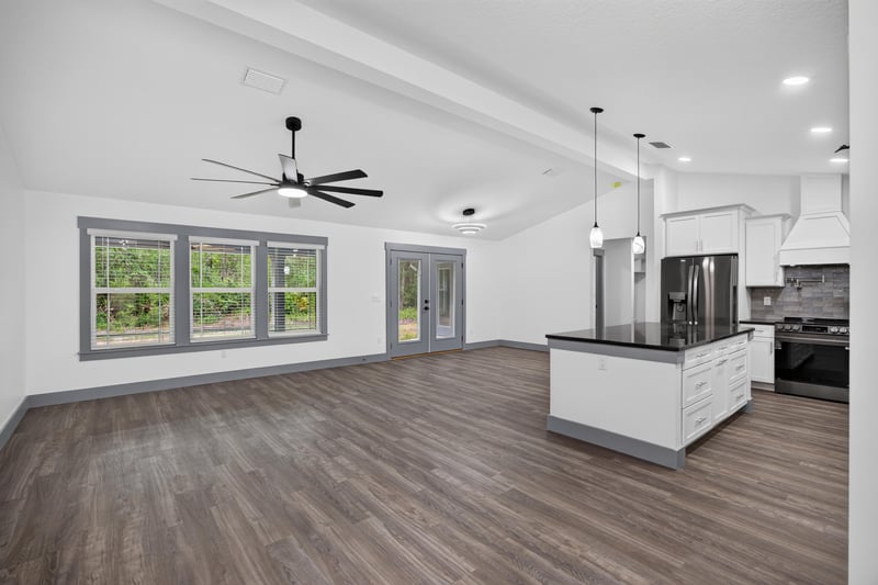 Kitchen island and dining area in open floor plan at 4800 Acacia St, Middleburg, FL 32068
