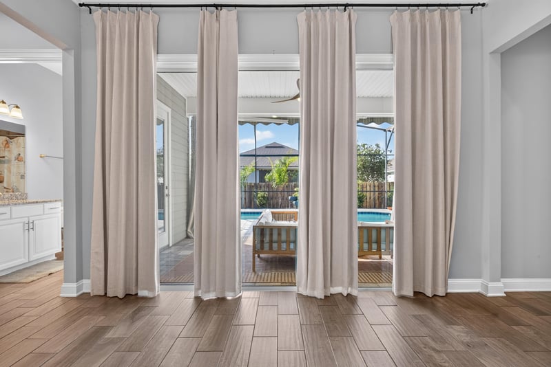 Primary bedroom with sliding doors to the pool at 3328 Southern Oaks Dr, Green Cove Springs, FL 32043