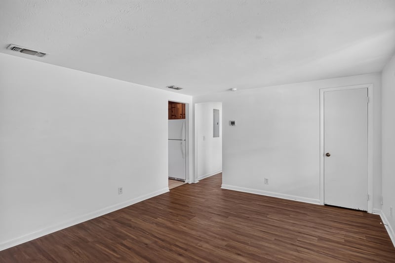 Empty living room with hallway doors at 5812 Tampico Rd, Jacksonville, FL 32244