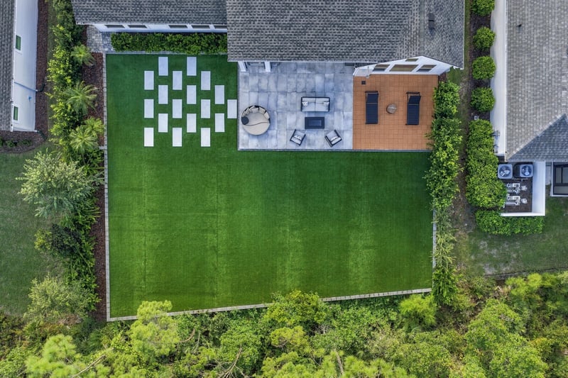 Aerial top-down view of the backyard paver patio pattern at 907 Seagrove Dr, Ponte Vedra Beach, FL 32081