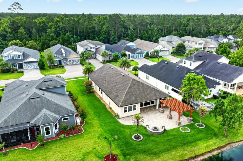 Aerial view of the home and backyard pond at 186 Freshwater Dr