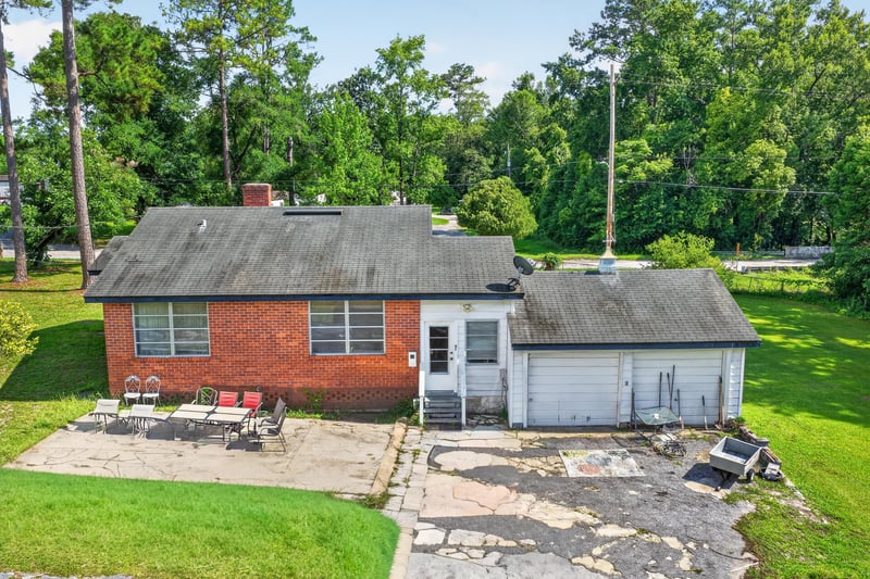 Side exterior with carport and driveway at 5745 110th St, Jacksonville, FL 32244