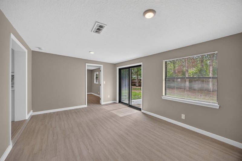Empty room with sliding door and windows at 184 Draco St, Orange Park, FL 32073