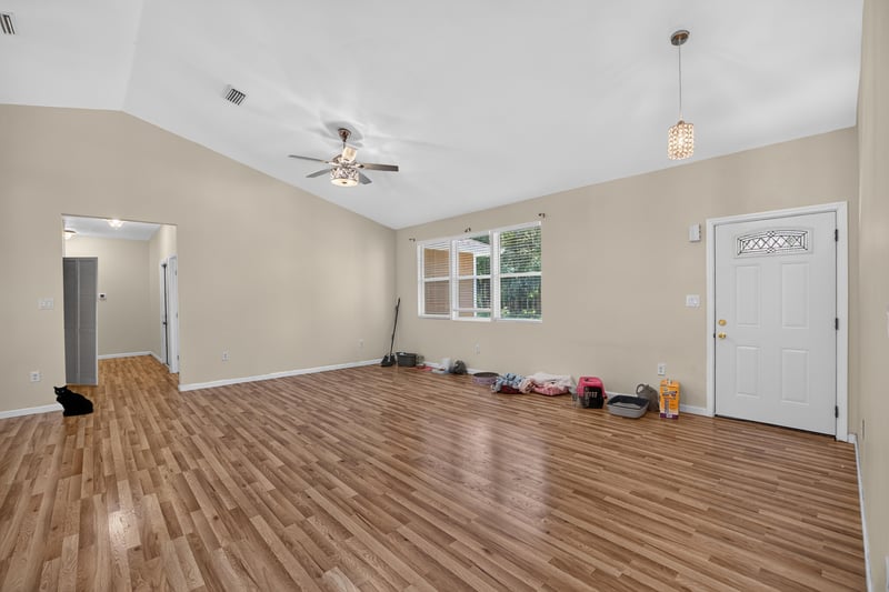 Living room view toward side door and windows at 1012 Fruit Cove Rd, Jacksonville, FL 32259