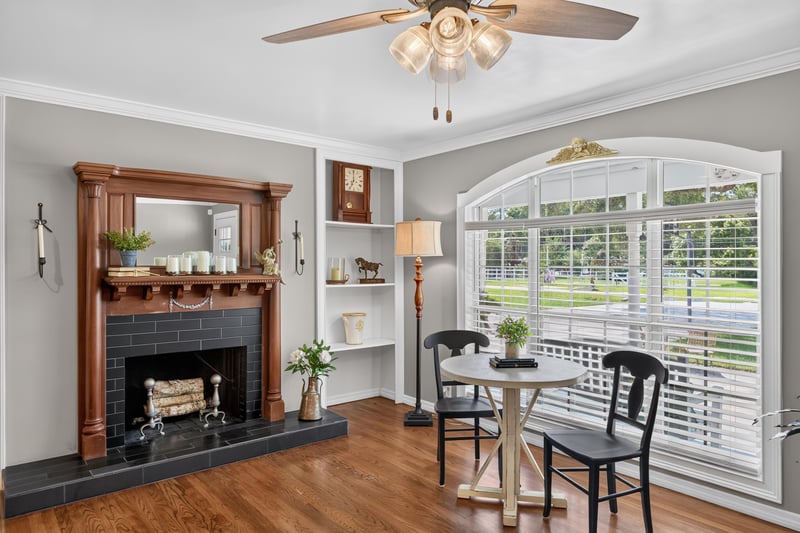 Dining nook with brick fireplace and bay window at 5843 Ovella Rd, Jacksonville, FL 32244
