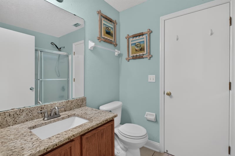 Bathroom with granite vanity and blue walls at 353 Redwood Ln