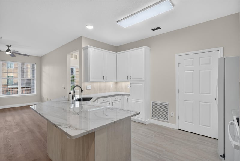 Kitchen island with quartz counters at 11251 Campfield Dr unit 1202, Jacksonville, FL 32256