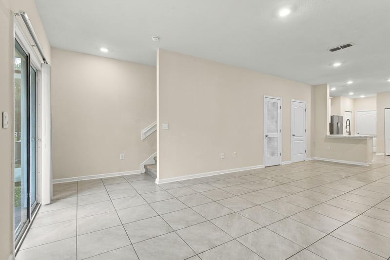 Living space opening toward the kitchen with tile floors at 9555 Star Dr, Jacksonville, FL 32256