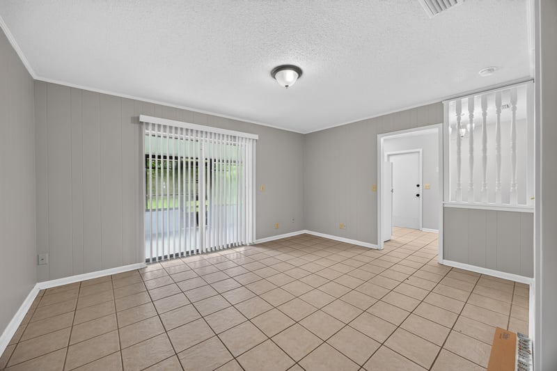 Dining area with sliding glass door and tile flooring at 12351 Condor Dr