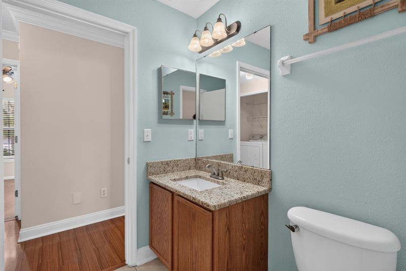 Bathroom vanity with mirror and light fixture at 353 Redwood Ln