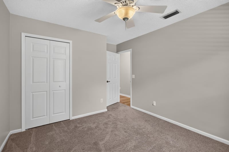Empty bedroom with closet door at 1955 GUARDED Way, Fleming Island, FL 32003
