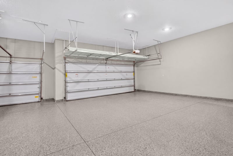 Three-car garage with epoxy floor at 22 Azura Point