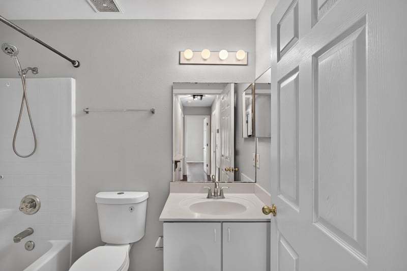 Bathroom with double vanity and mirror at 7329 Lawn Tennis Ln, Jacksonville, FL
