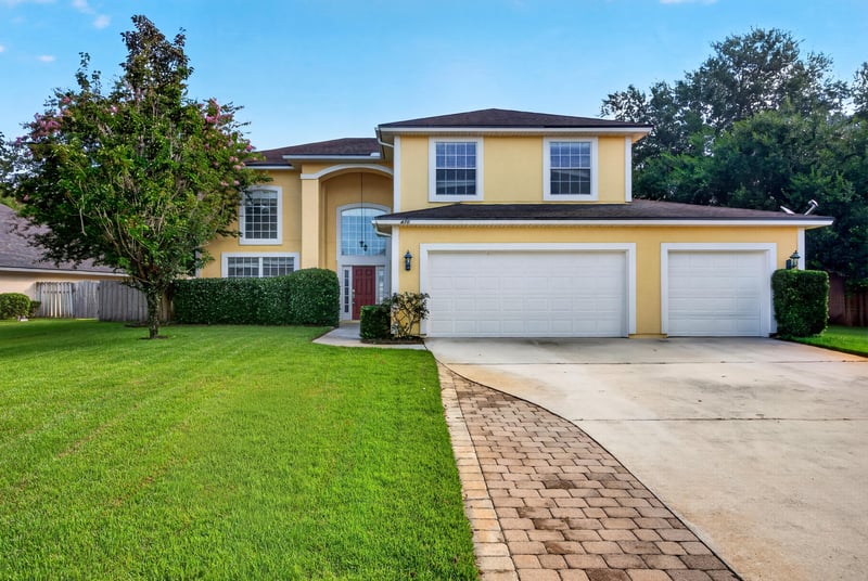 Front exterior, paver driveway and mailbox at 470 Sparrow Branch Cir, Jacksonville, FL 32259