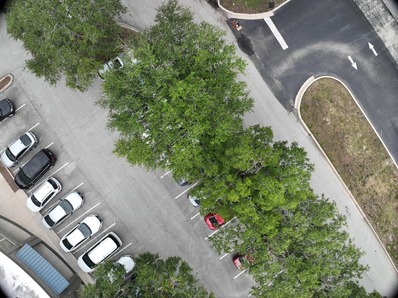 Aerial view of parking rows and landscaped curve at 9406 Atlantic Blvd, Jacksonville, FL 32225