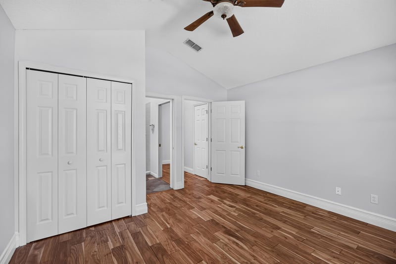 Bedroom panorama with double closets at 11675 Magnolia Estates Rd, Jacksonville, FL 32223