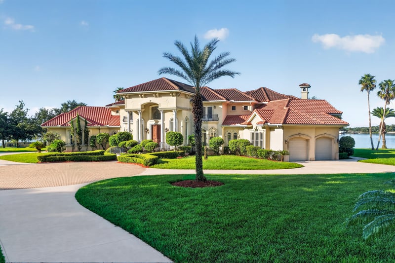 Front exterior with palm tree and motor court at 344 Broward Rd, Jacksonville, FL