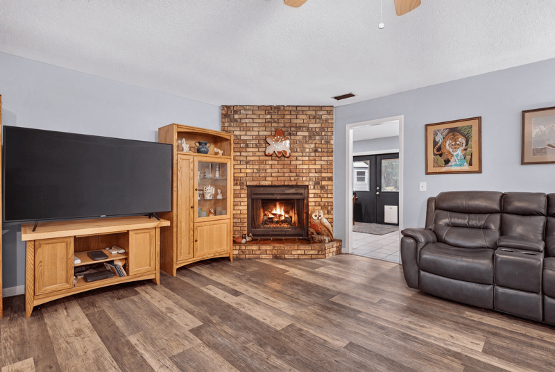 Living room view toward fireplace and hallway at 3249 Maryland Ave, Green Cove Springs, FL