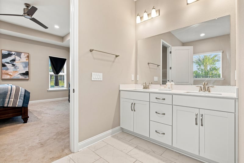 Primary bathroom vanity with white cabinetry at 27 Holly Rdg Wy, St. Augustine, FL