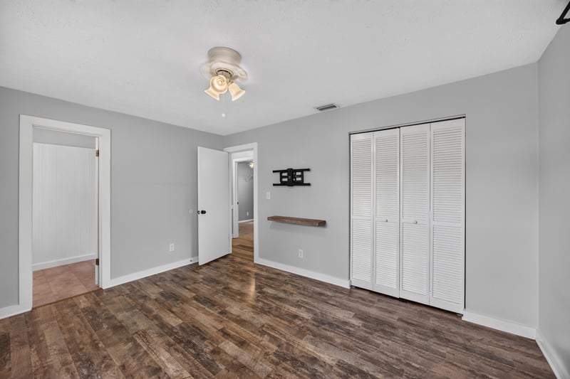Hallway with closets and multiple door openings at 6757 Deer Springs Rd, Keystone Heights, FL 32656