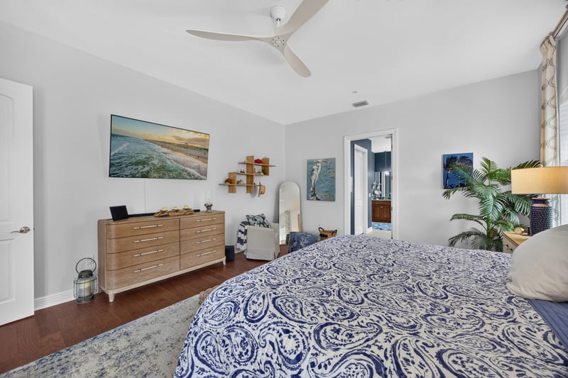 Bedroom with dresser and patterned bedding at 140 Ave De La Mer, Palm Coast, FL 32137