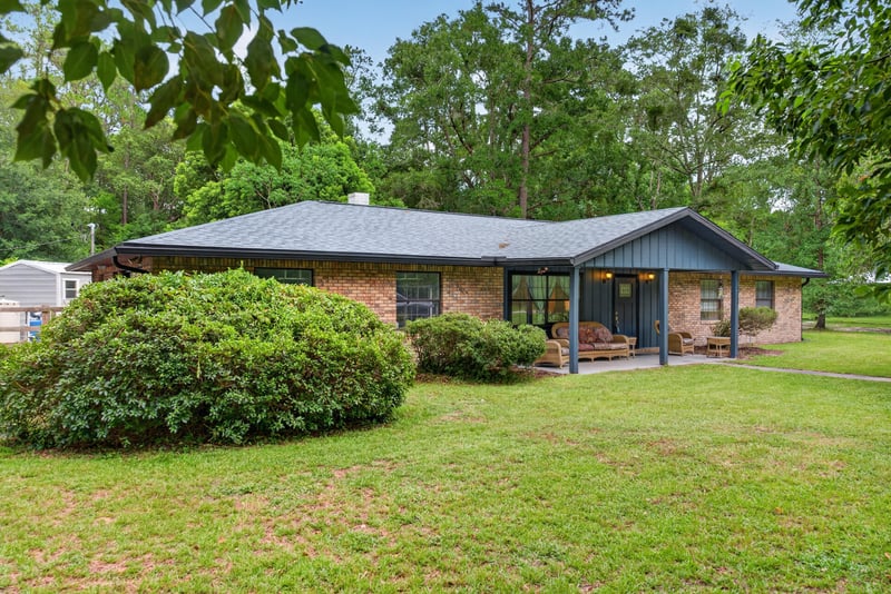 Brick ranch front exterior with metal roof and lawn at 3249 Maryland Ave, Green Cove Springs, FL