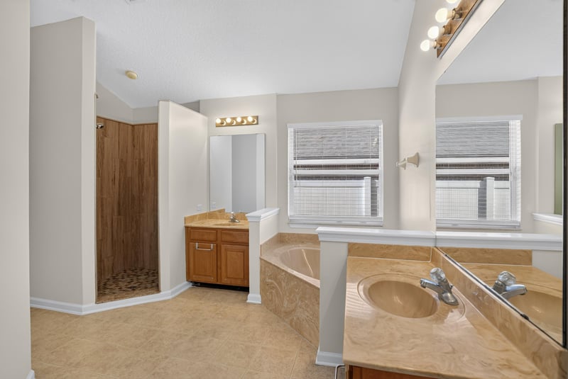 Primary bathroom with garden tub and dual vanity at 299 John's Creek Pkwy, St. Augustine, FL 32092