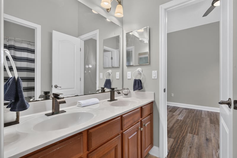 Bathroom with double vanity and wood floor at 4109 Eagle Landing Pkwy, Orange Park, FL 32065