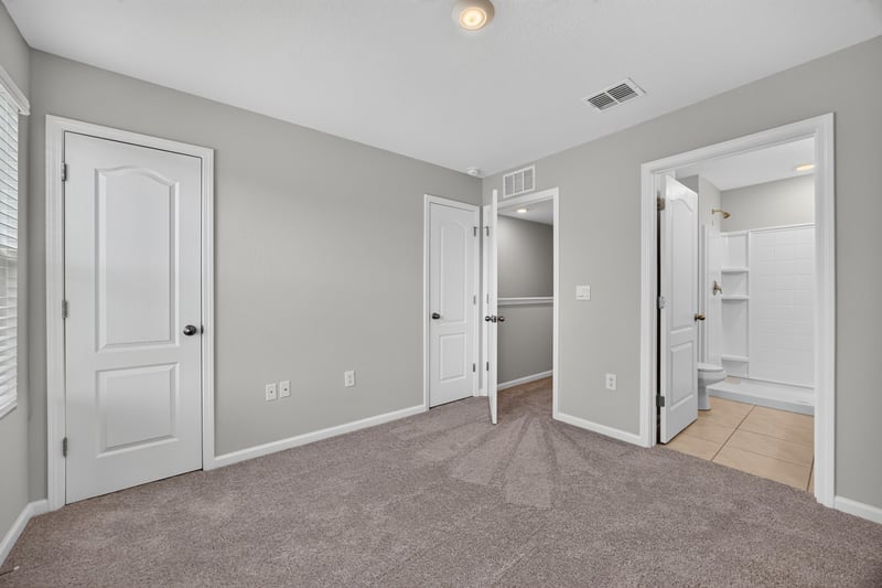Hallway with closet doors near bedrooms at 2837 Black Buck Cir, Jacksonville, FL 32225